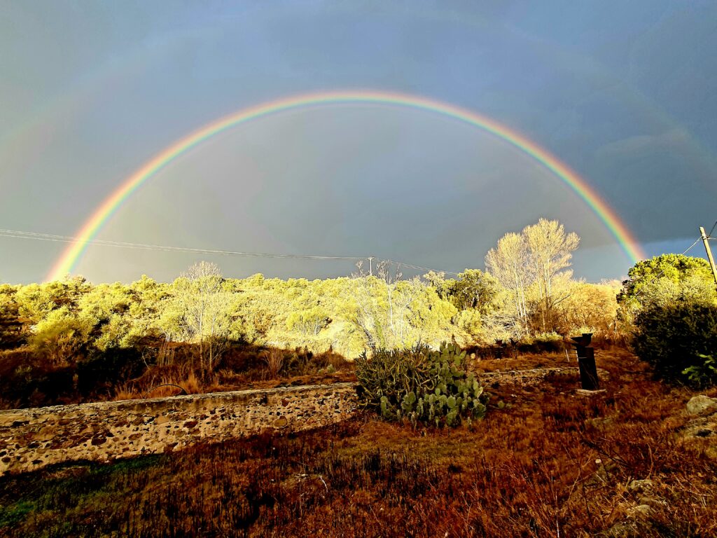 rising rainbow above the house at Spain